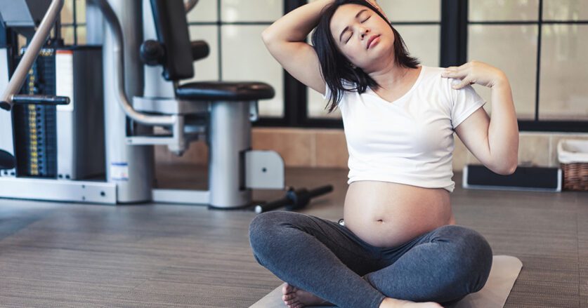 Active Pregnant Woman Exercise In Fitness Center